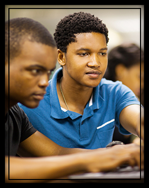 Two high school students researching colleges together